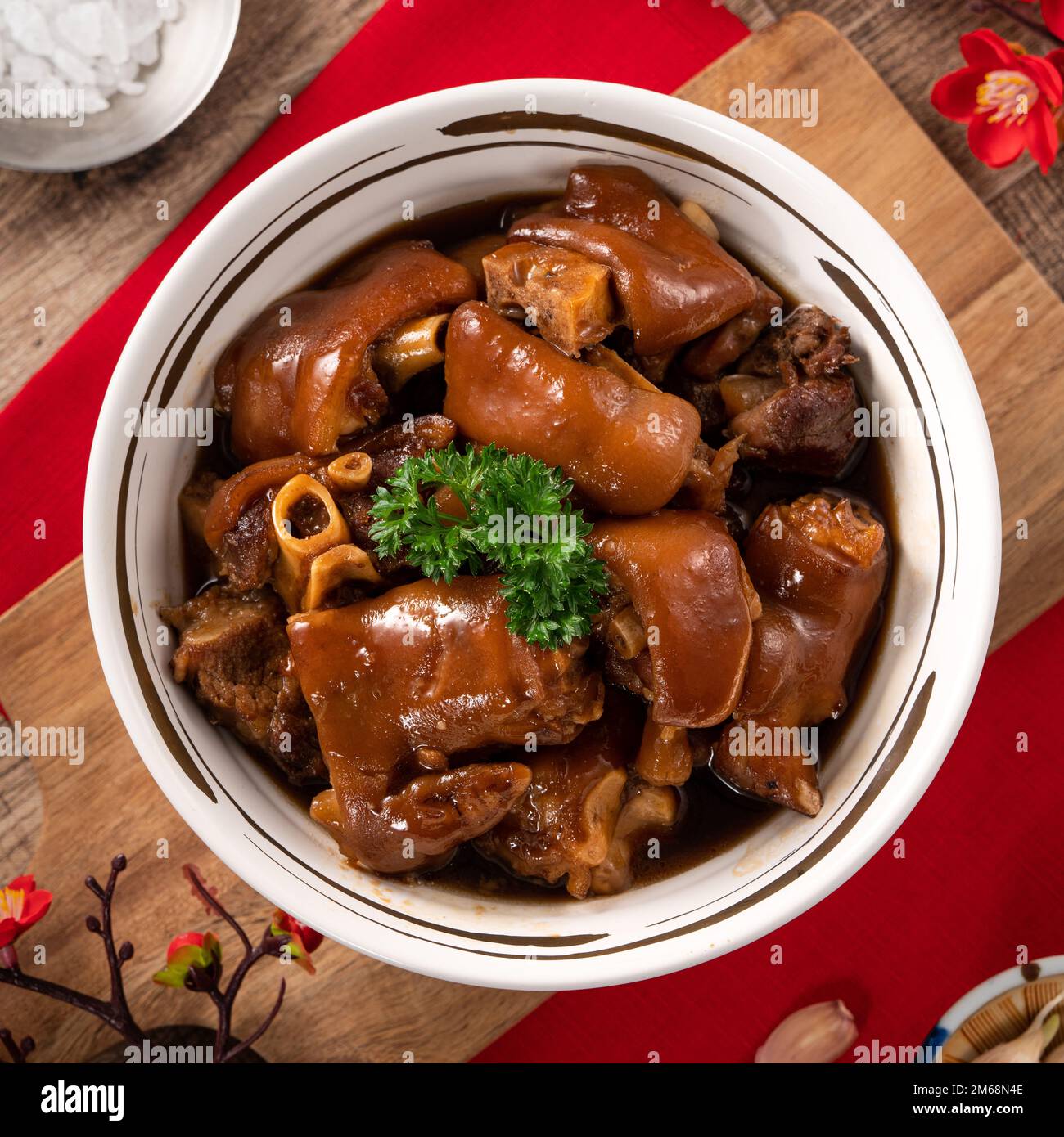 Taiwanese traditional food pork knuckle in a white bowl with golden