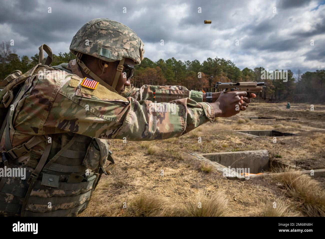 U.S. Army Spc. Adenuga Faheed, 154th Quartermaster Company, fires an ...