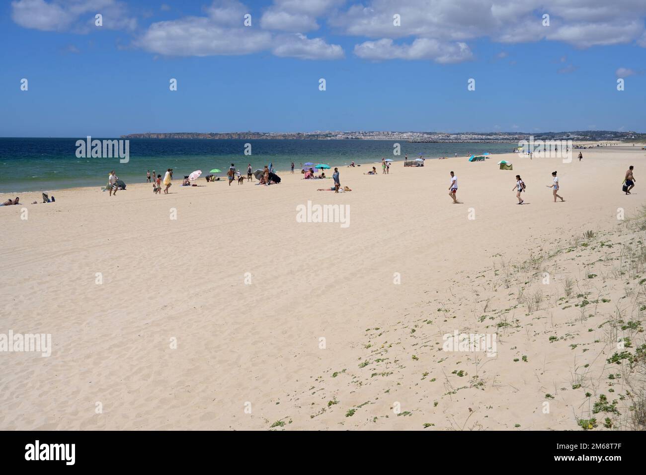 Tourists and sun bathers at Alvor beach,, Portimao municipality, Algarve, Portugal Stock Photo