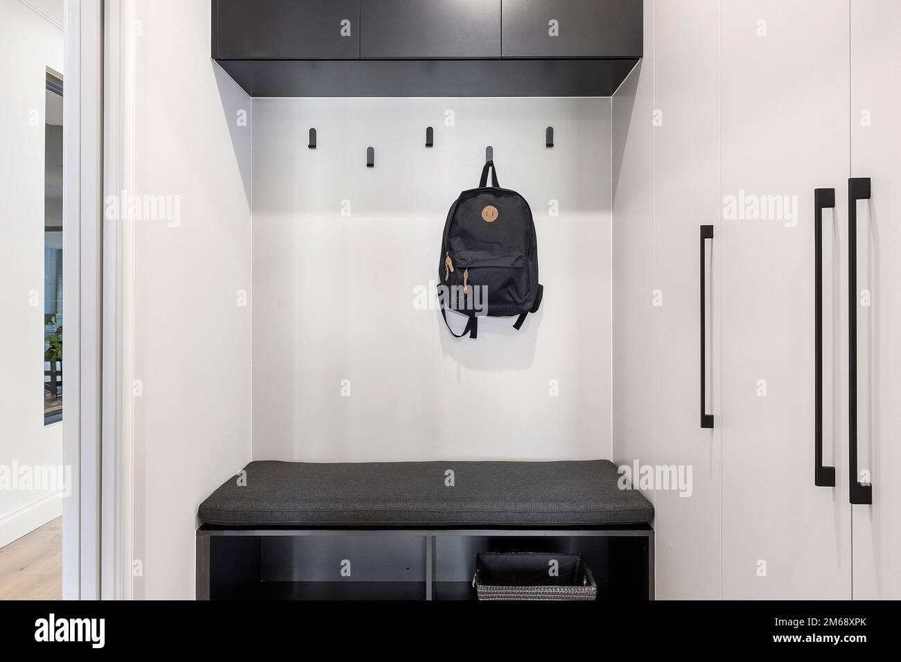interior of a modern house's cloak room and where to hang coats and