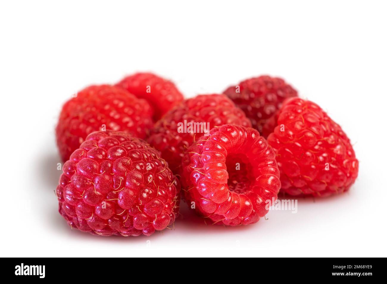 Bunch of raspberry fruits isolated on white background Stock Photo - Alamy