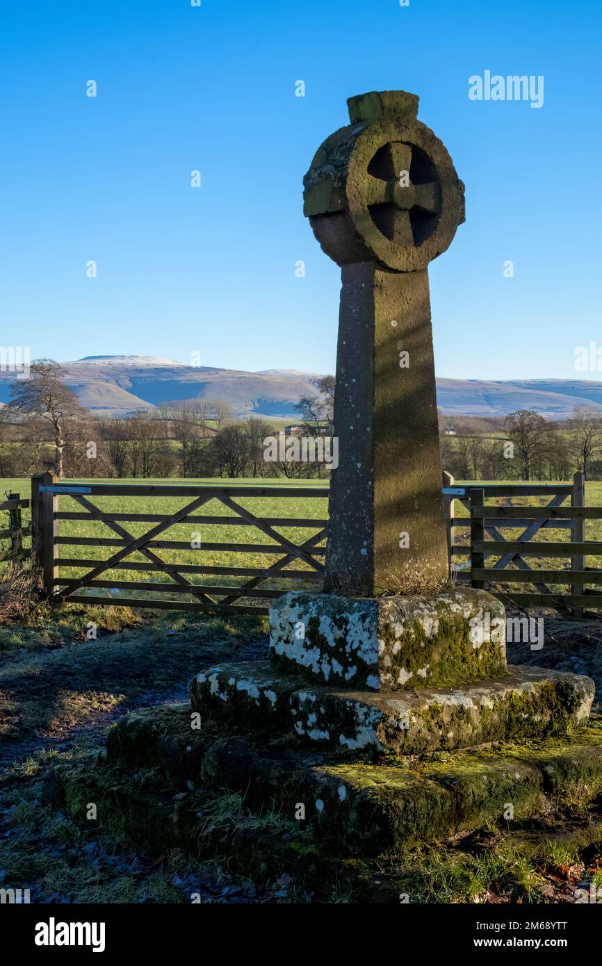 The supporting medieval plinth of a 16th century roadside plague stone, Edenhall, Langwathby, Cumbria, UK Stock Photo