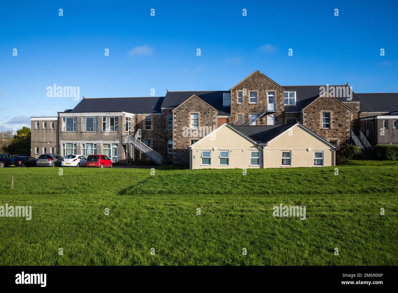 Blue sky over Camborne Redruth Community Hospital in Cornwall Stock