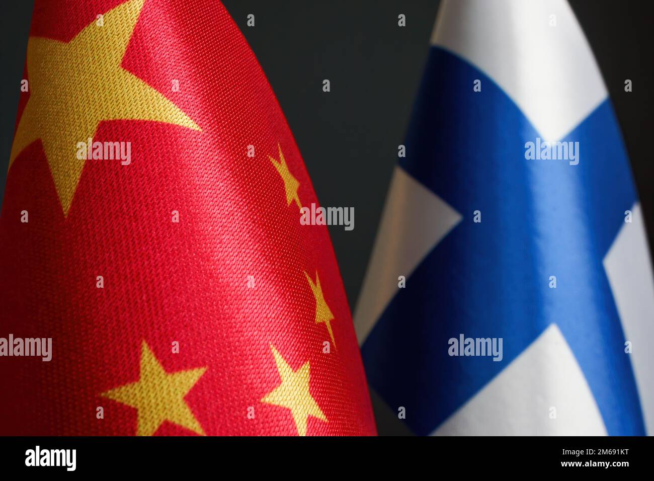 Close-up of small flags of China and Finland. Stock Photo
