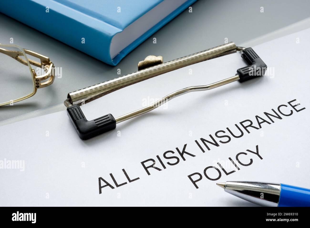 Clipboard with all risk insurance policy and pen. Stock Photo