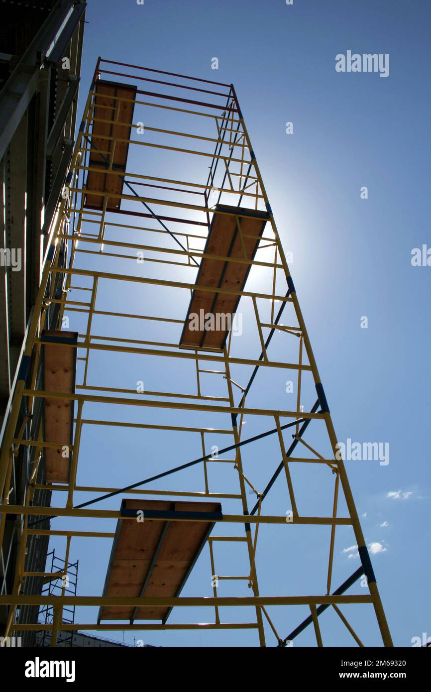 Scaffolding on blue sky background Stock Photo
