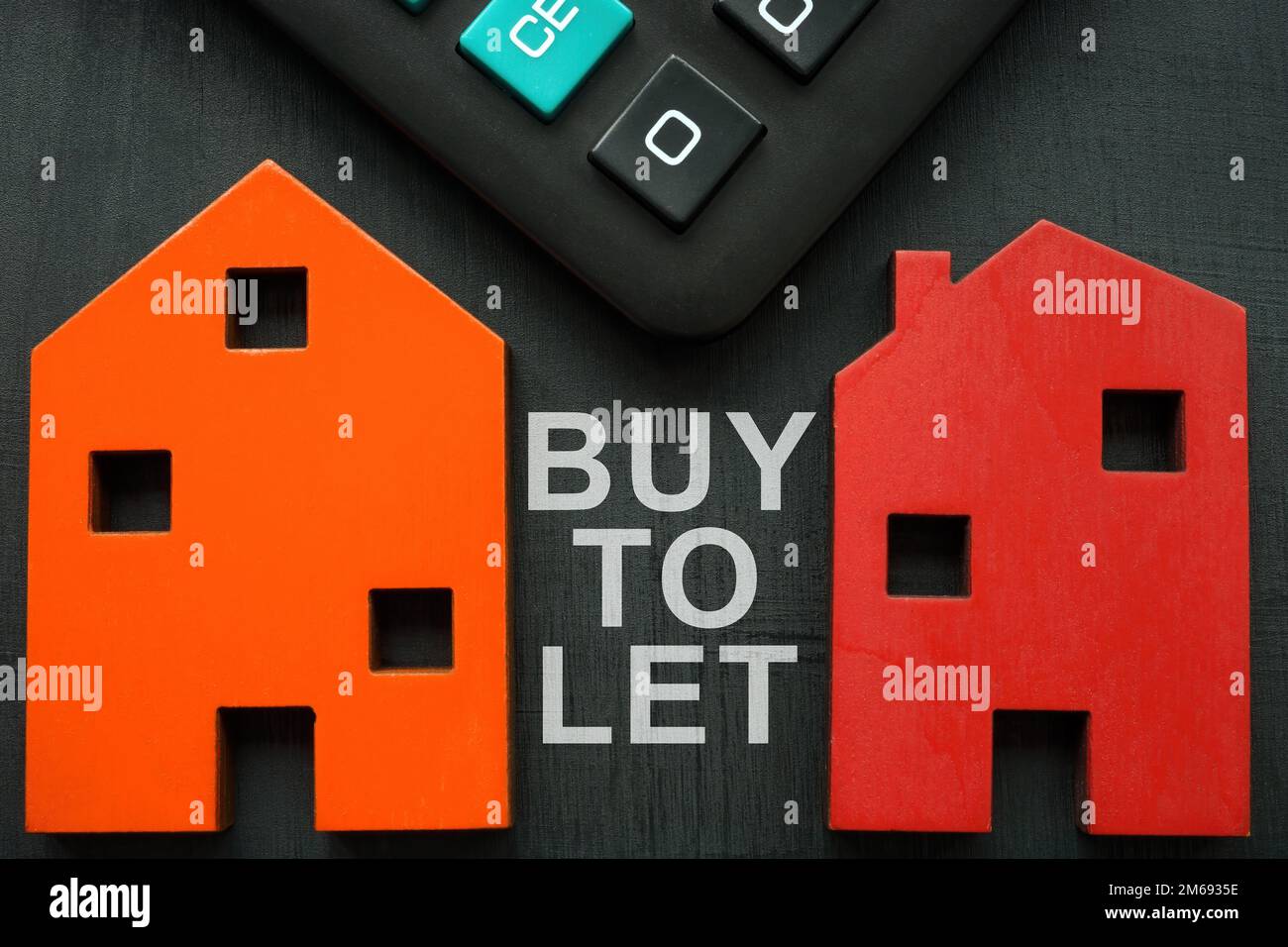 Models of house, calculator and inscription Buy to let BTL. Stock Photo