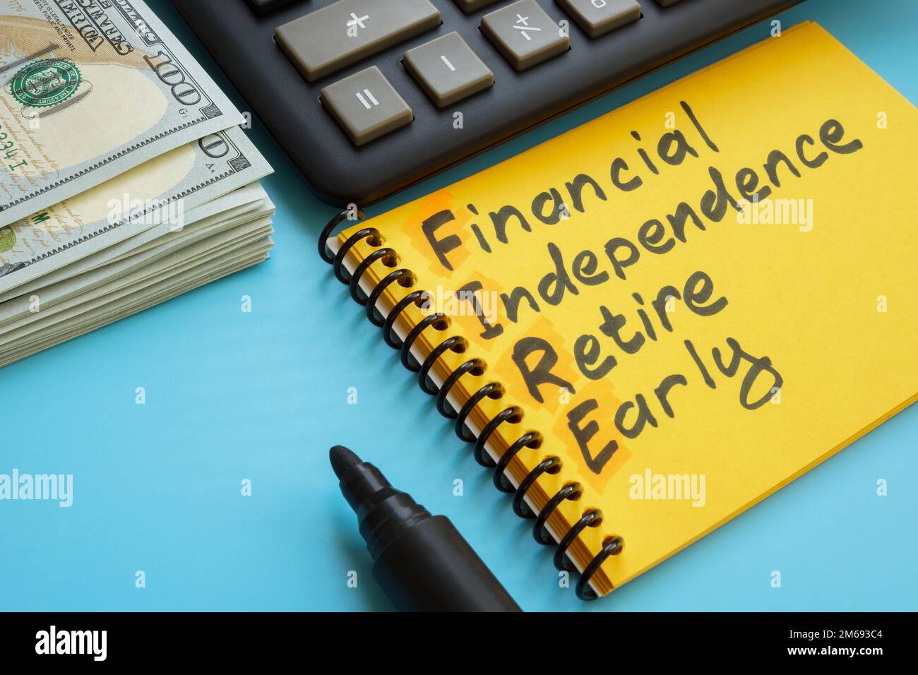Page with inscription Financial independence retire early FIRE and cash. Stock Photo