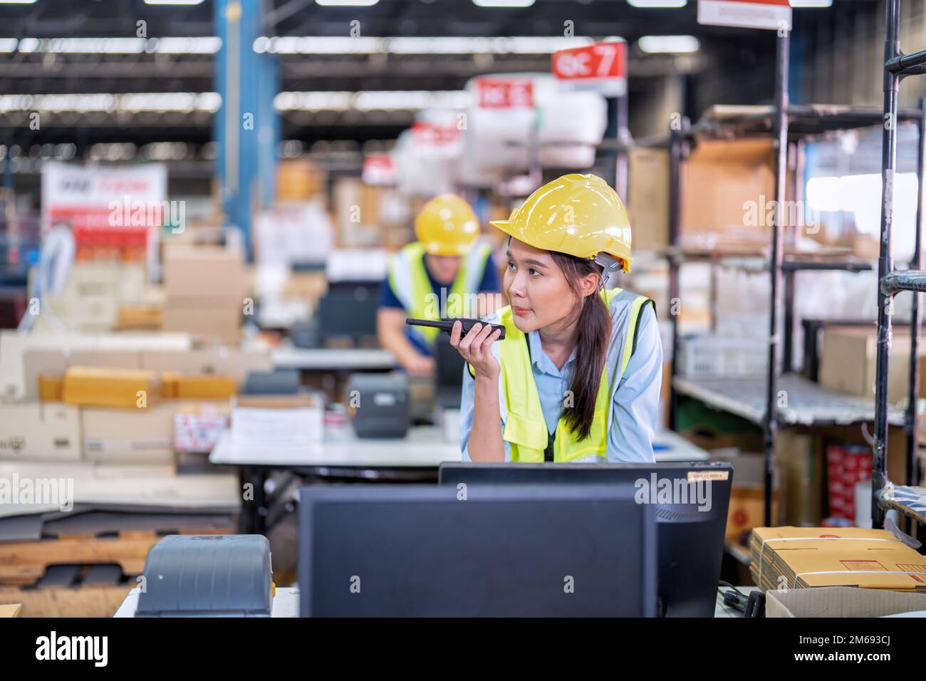 Worker working in the large depot storage warehouse concentrate check