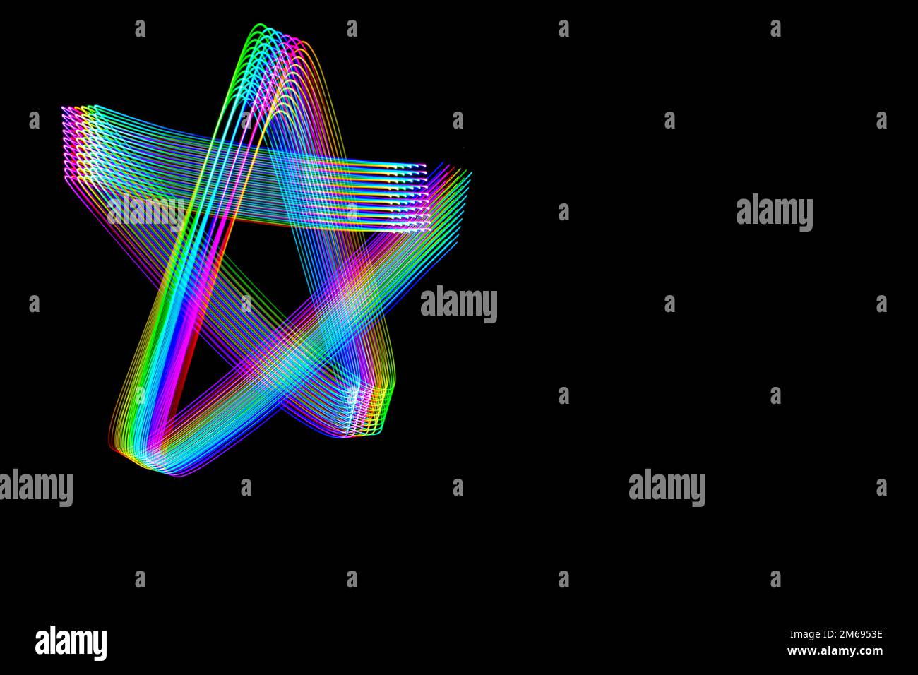 Beautiful light painting designs on dark black background. Long exposure patterns on black Stock ...