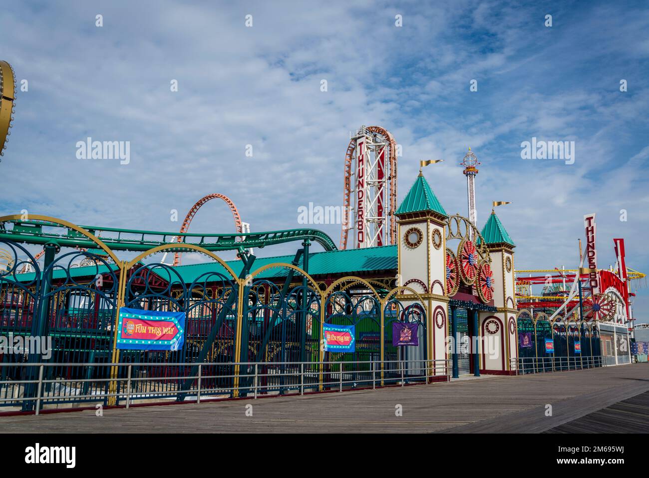 Leti's Treasure & Toni's Express and Thunderbolt rollercoasters on the Riegelmann Boardwalk at Coney Island, Brooklyn, New York City, USA Stock Photo