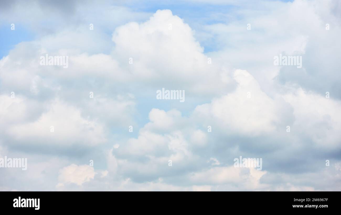 White heap clouds in the sky - background, cloudscape Stock Photo