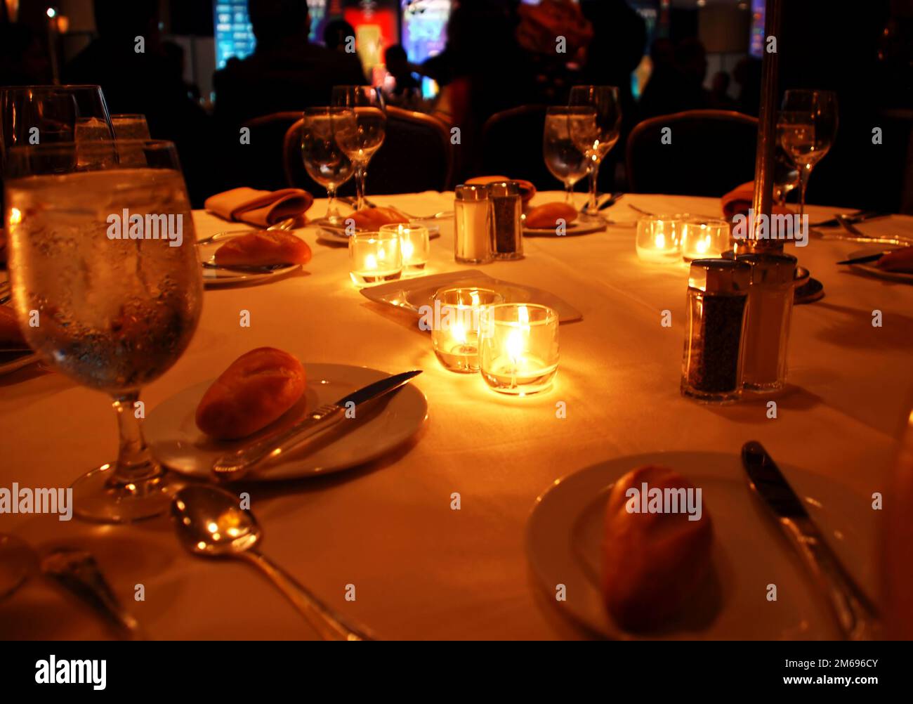 round table appointments with candles on gala dinner in restaurant