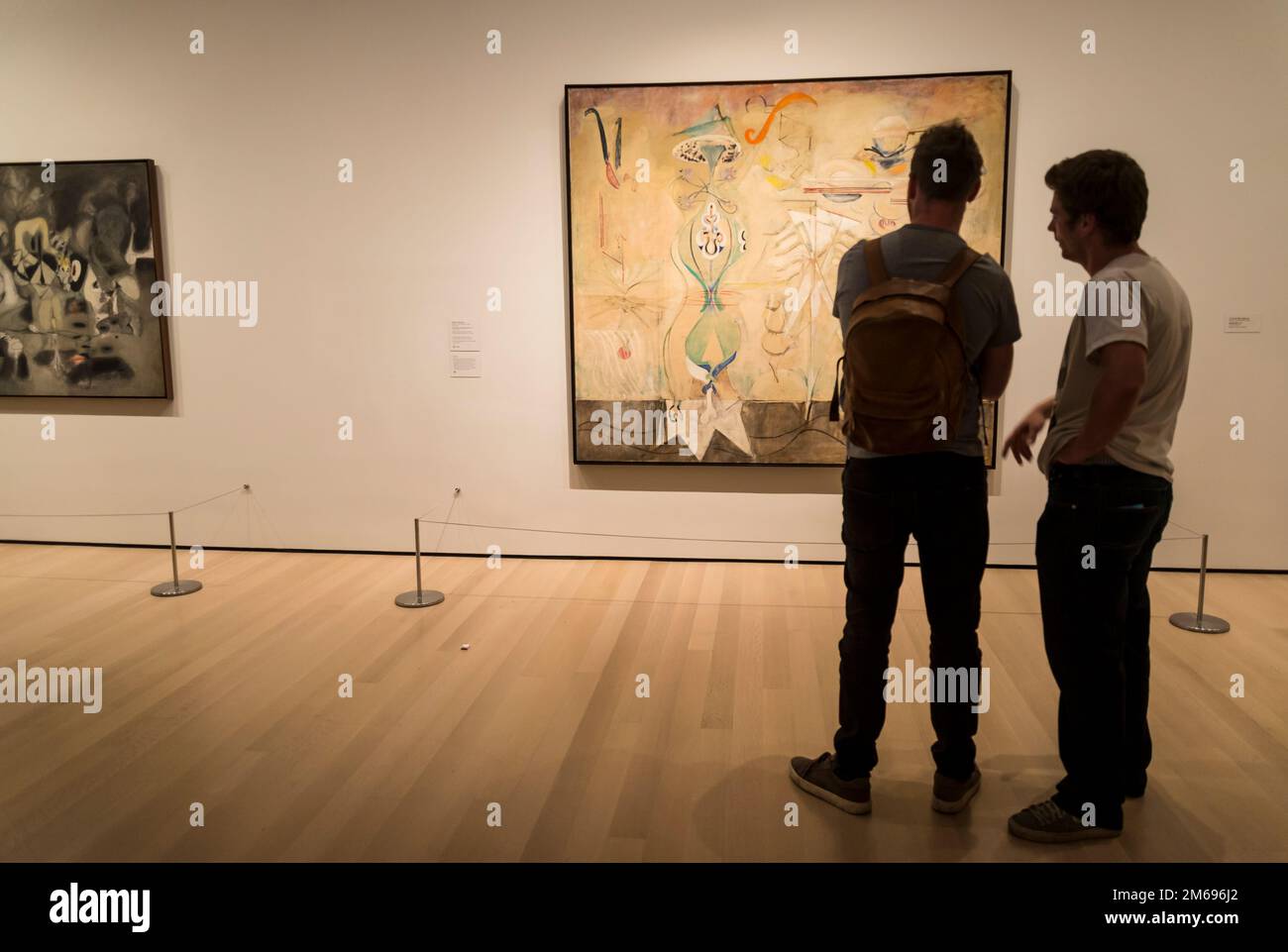Visitors looking at Mark Rothko painting Slow Swirl at the Edge of the Sea, 1944, MOMA, The Museum of Modern Art, New York City, USA Stock Photo