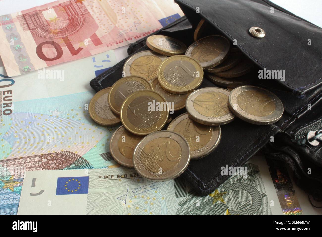 Wallet and a few Euros Stock Photo - Alamy