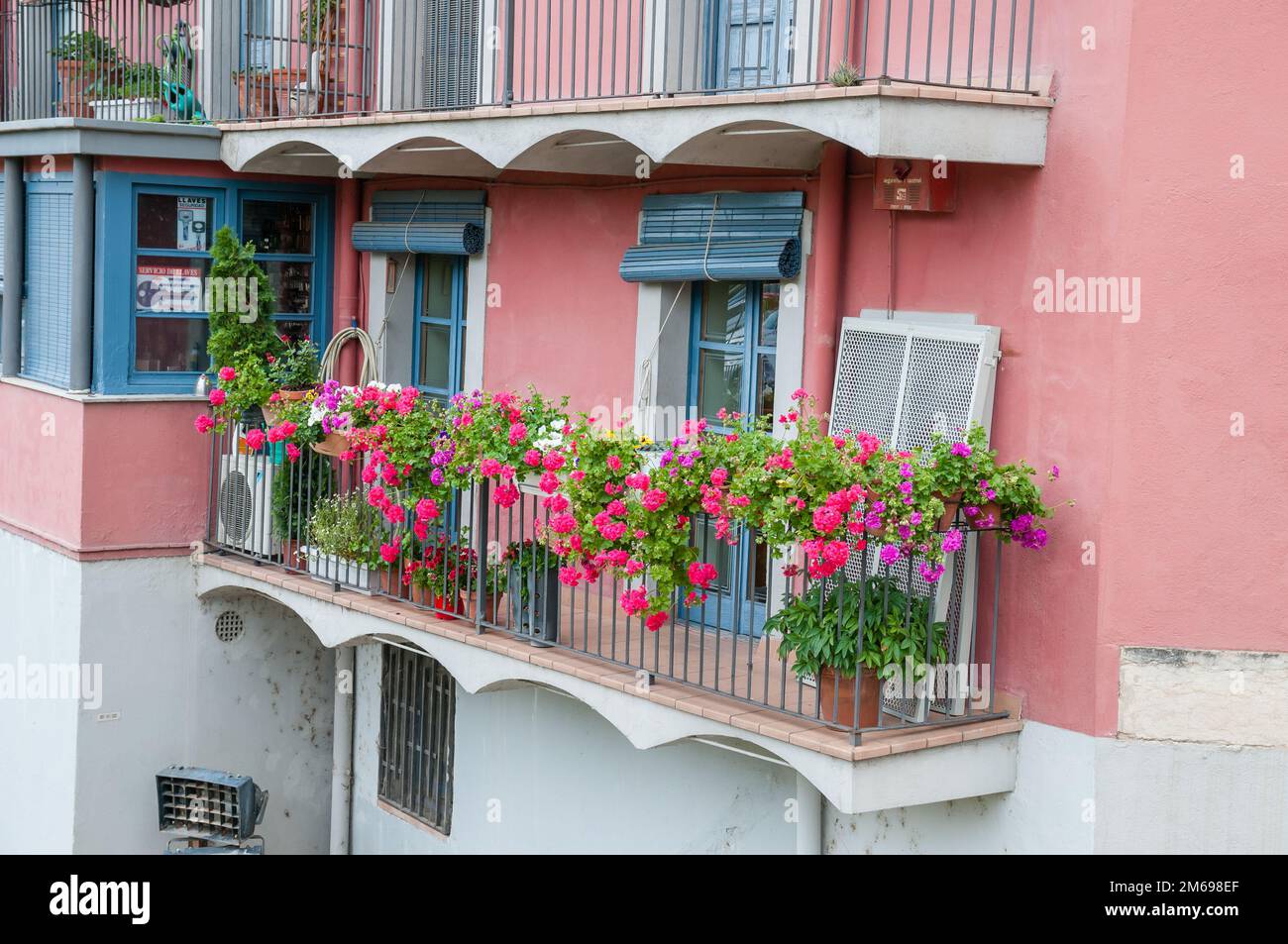 balcony with flowers, The Houses on the River Onyar, Girona, Catalonia, Spain Stock Photo