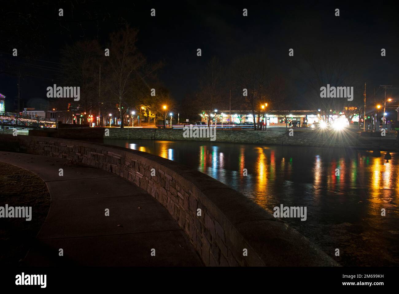 Festive lights reflecting in Peddie Lake, East Windsor, New Jersey at an end of year holiday