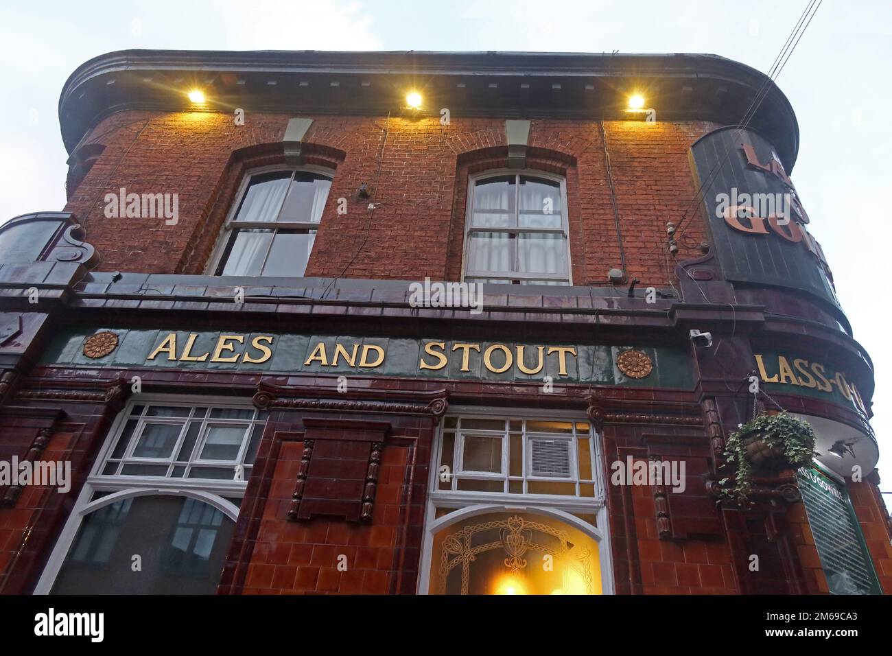 Ales and Stout tiles on side of Lass o'Gowie pub, 36 Charles St, Manchester, England, UK,  M1 7DB Stock Photo