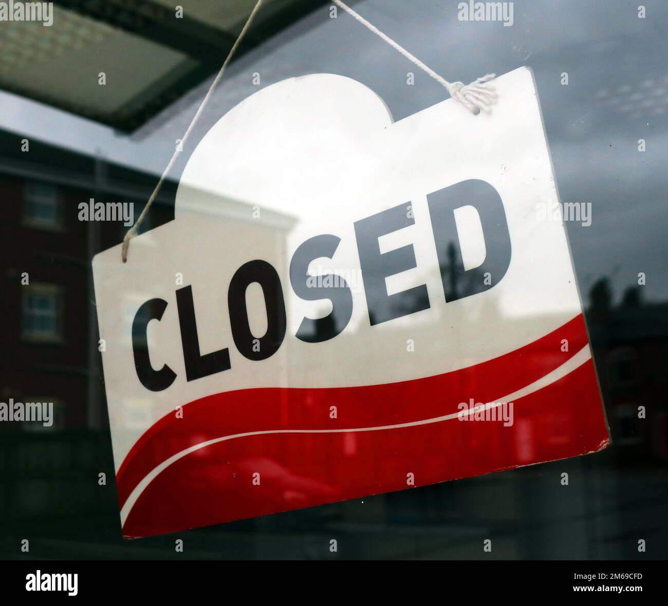 Red & white, Closed sign, in a shop doorway Stock Photo