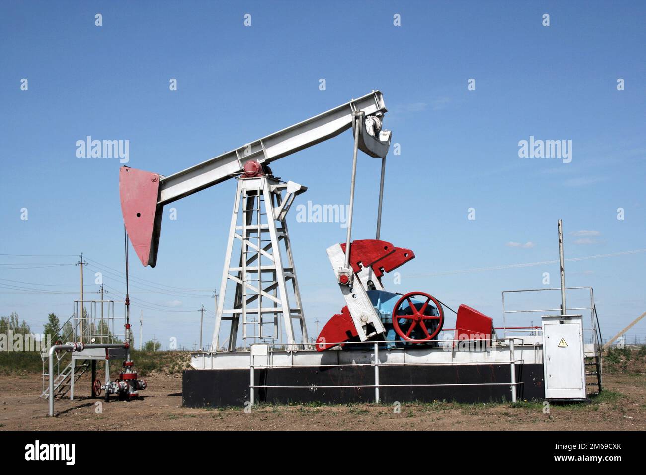 Industrial construction and mechanism. Oil pump jack. Stock Photo