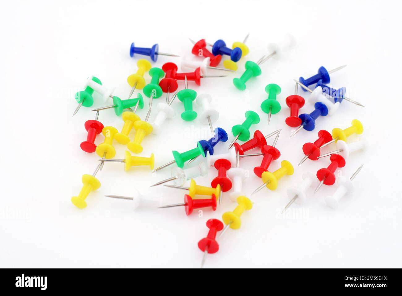 Colored push pins isolated on white background Stock Photo - Alamy