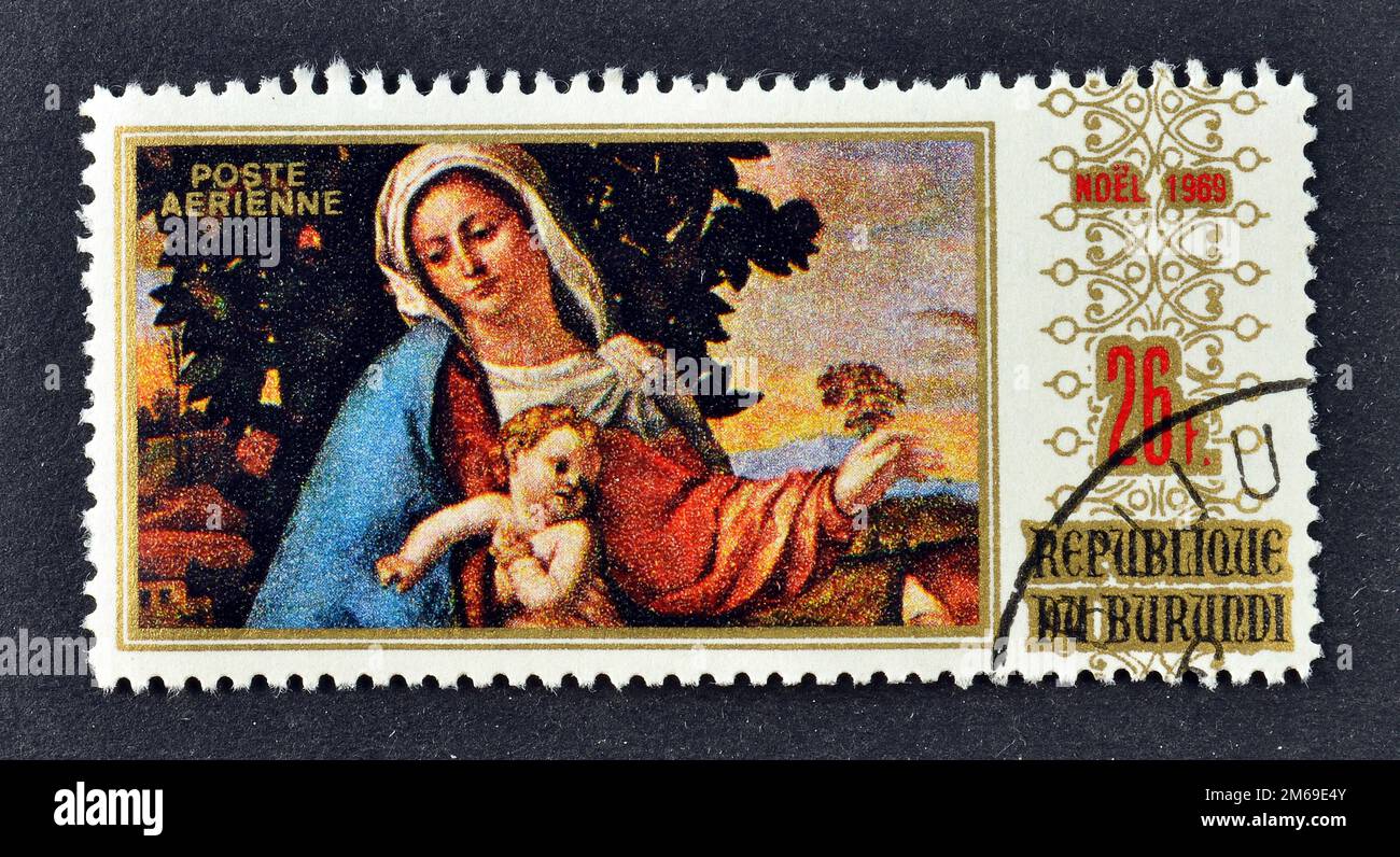 Cancelled postage stamp printed by Burundi, that shows painting Madonna and child by Palma il Vecchio, Christmas, circa 1969. Stock Photo