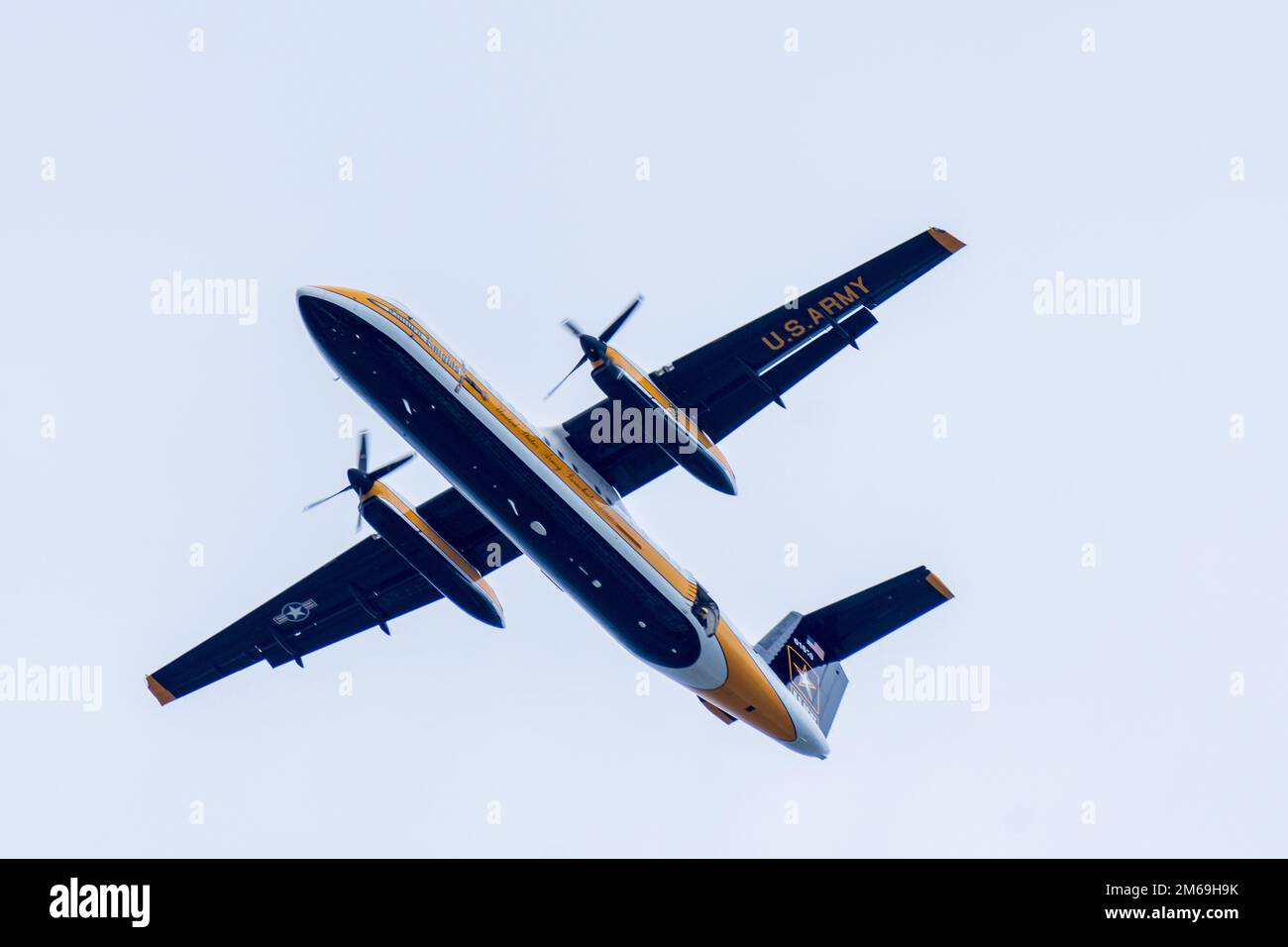 The U.S. Army Parachute Team jump aircraft, the C147A, flies over