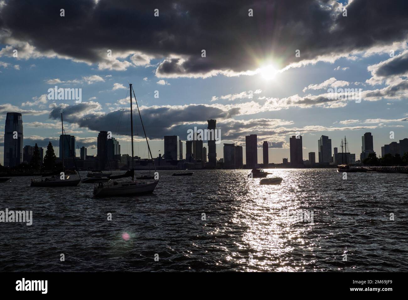 New York Sity harbour and skyskraper view with sunset frontlight at hudson river Stock Photo