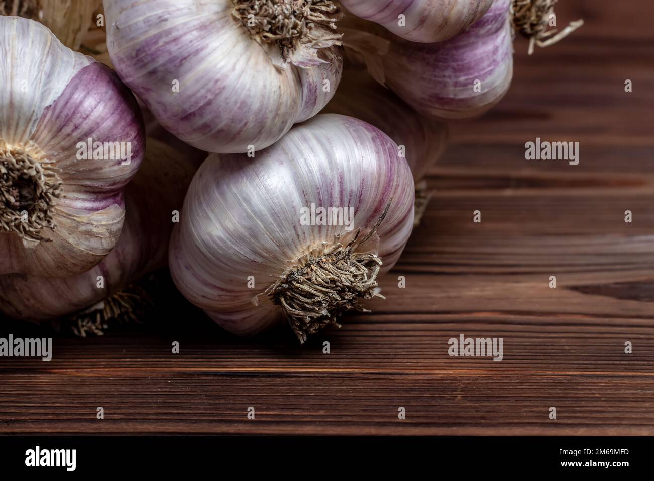 Garlic Cloves and Bulb on vintage wooden boards Stock Photo - Alamy