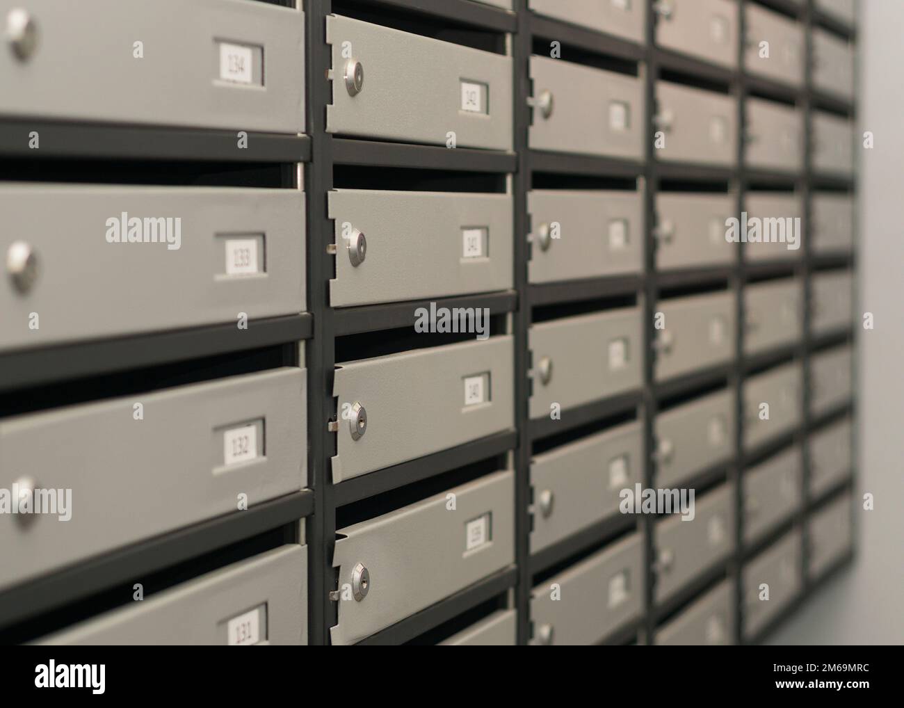 Mailboxes filled with numbers. In an apartment building Stock Photo Alamy