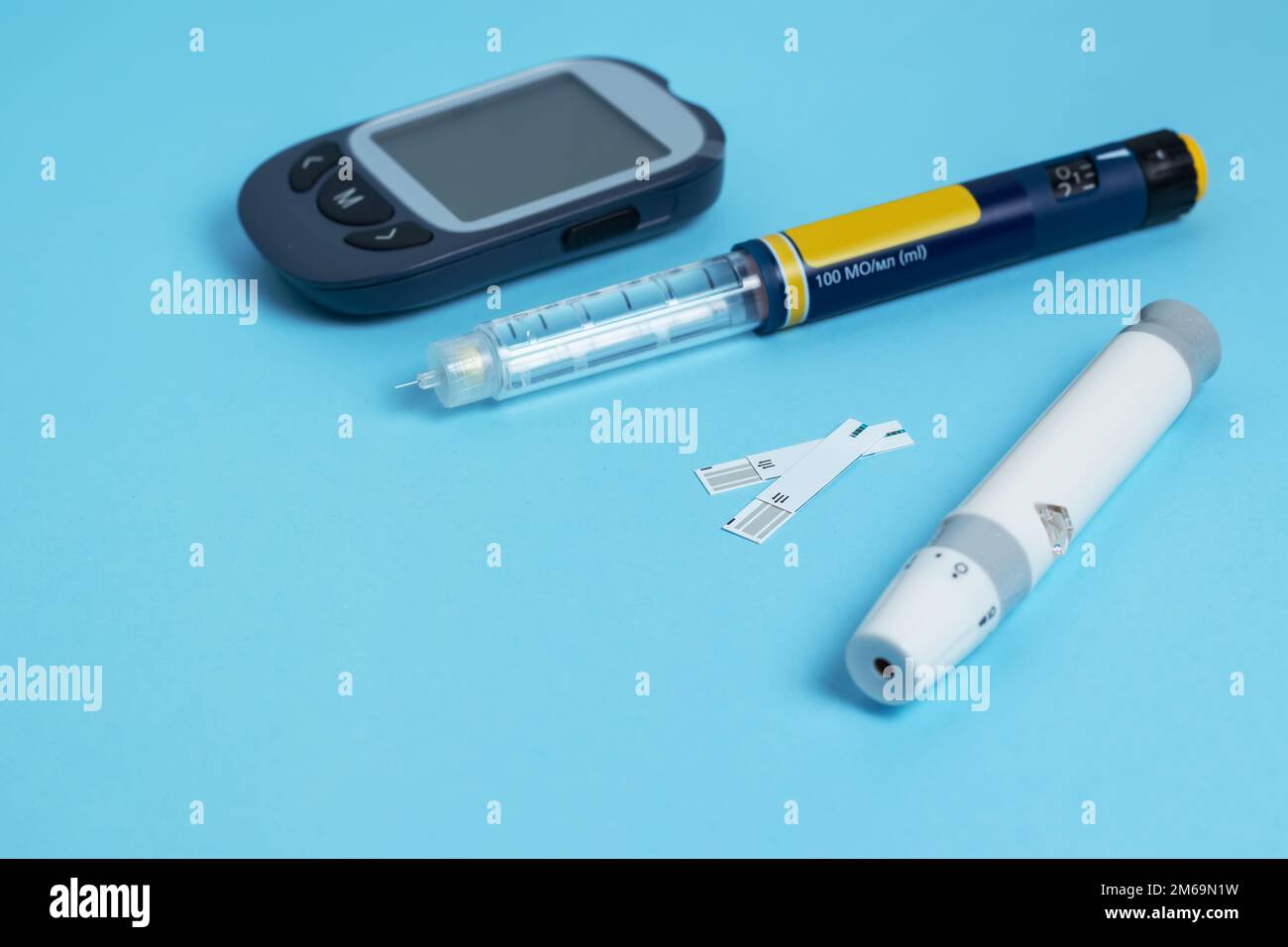 Measuring blood sugar. insulin pen, lancet and test strip