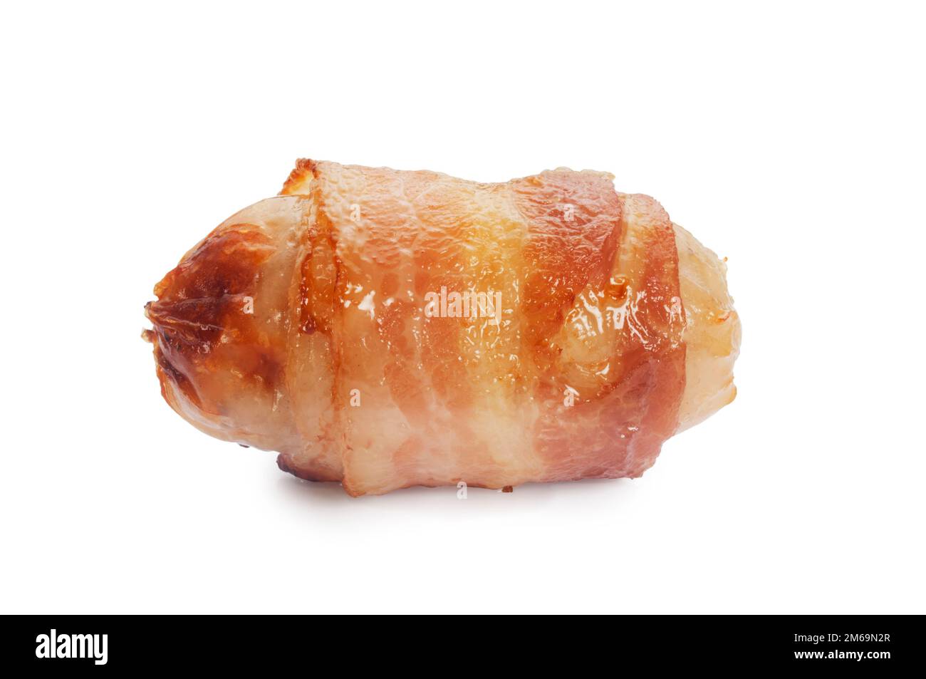 Studio shot of traditional cooked pigs in blankets cut out against a white background - John Gollop Stock Photo