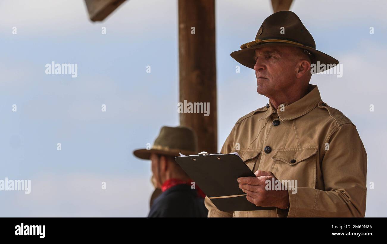 Jeffrey Wall, a judge for the Regional Cavalry Competition, observes and scores riders during the field jumping event, April 21, 2022, at the Fort Concho National Historic Landmark, San Angelo, Texas. 'A military horse that can’t jump an obstacle is no use to anybody,' said Wall. 'The military field jumping course tests the horse and the rider’s ability to jump various obstacles.” Stock Photo