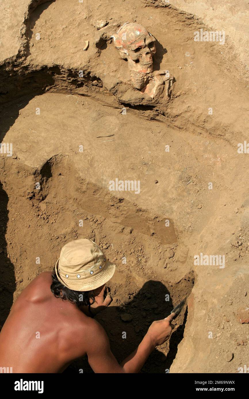 Archaelogist works on excavation Stock Photo