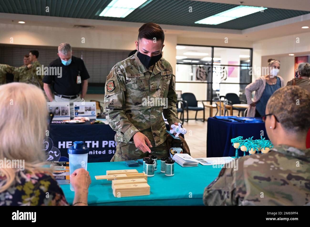 A member of Team Kirtland receives a souvenir during a base helping agencies open house at Kirtland Air Force Base, N.M., April 21, 2022. KAFB hosted the event to highlight services from agencies such as the Airman and Family Readiness Flight, Base Chapel, Military OneSource and more. Stock Photo