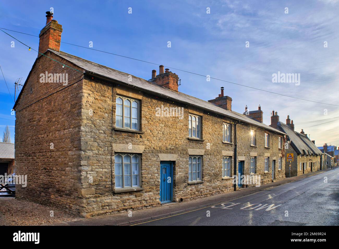 Sharnbrook, Bedfordshire, England, UK - Stone built cottages in the village high street Stock Photo