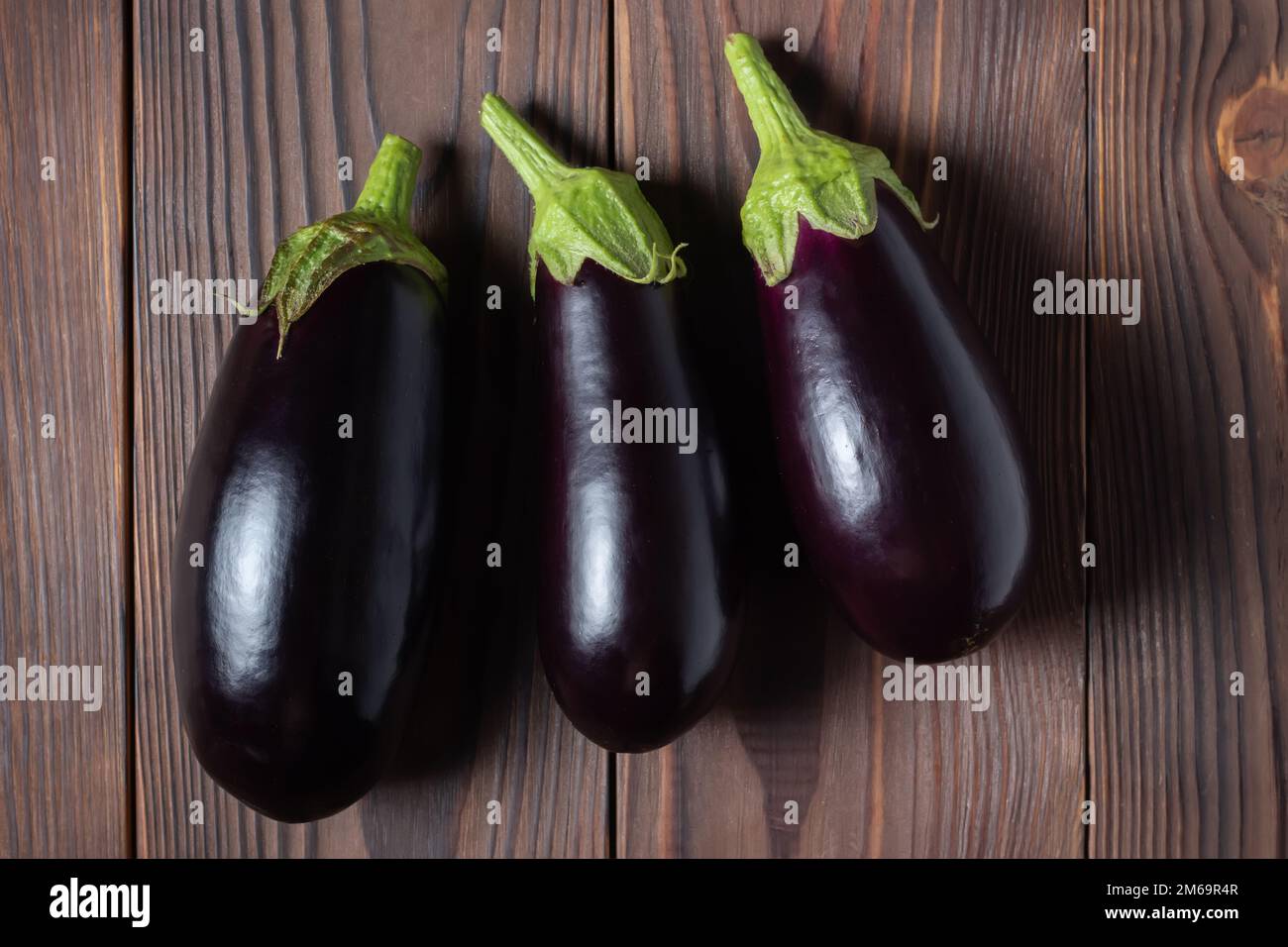 Frsh organic eggplant on the wooden boards. Stock Photo
