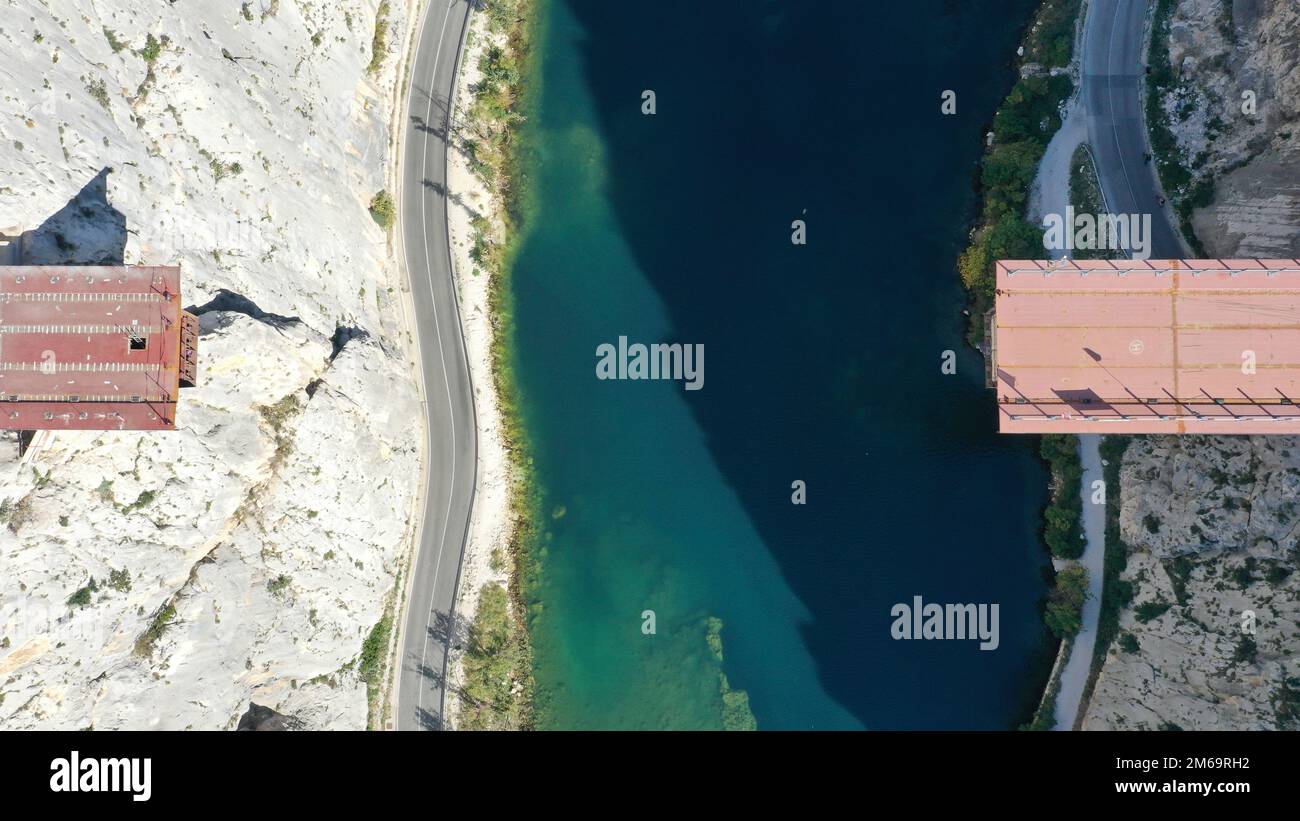 Aerial photo of construction works on a bridge over Cetina river in Omis,  Croatia, on October 27, 2022. The Omis bridge includes two tunnels and a  bridge over the Cetina river, the