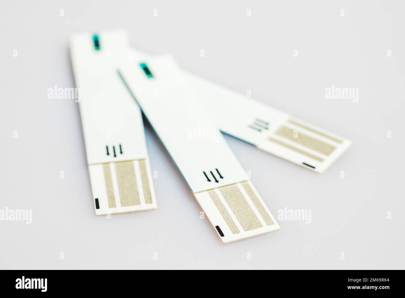 Glucometer test strips on a white background. Stock Photo