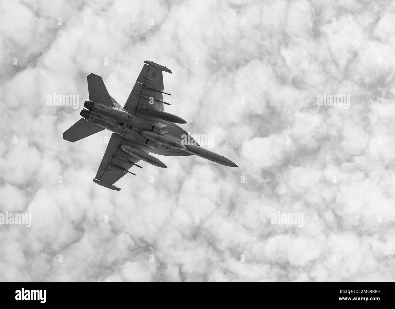 220421-N-LZ839-1258  NORFOLK, VA. (April 21, 2022) -  An EA-18G Growler, assigned to Air Test and Evaluation Squadron (VX 23), performs flight operations above the amphibious assault ship USS Bataan (LHD 5) as part of the precision approach and landing system certification, April 21, 2022. Bataan is underway in the 2nd fleet area of operations. Bataan is homeported at Naval Station Norfolk. Stock Photo