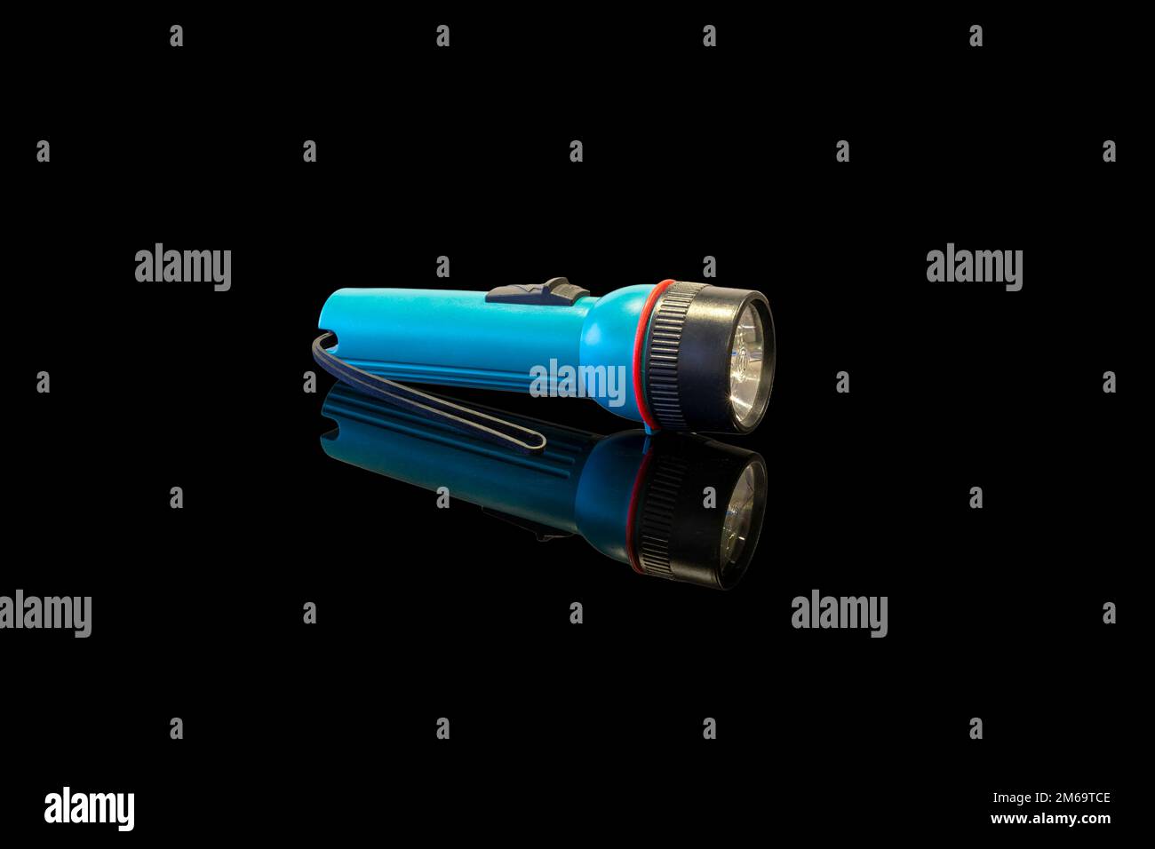 battery-powered flashlight on a black background Stock Photo