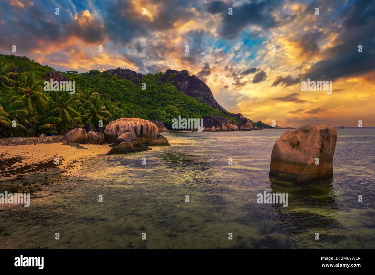 Colorful sunset over Anse Source D'argent beach at La Digue Island, Seychelles Stock Photo