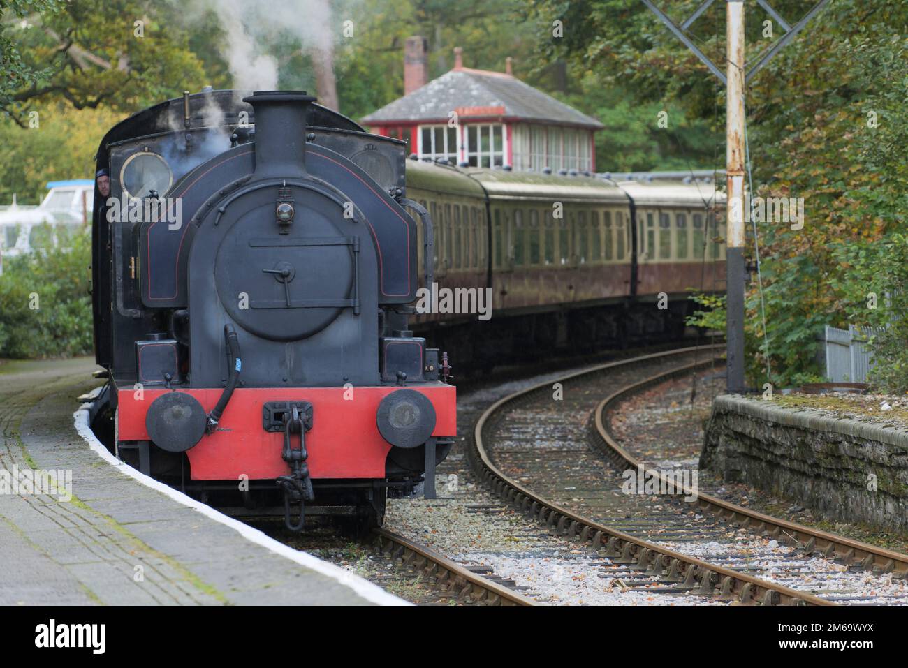 Steam train arriving at Lakesiode on the Lakeside & Haverthwaite Railway line, Cumbria, England Stock Photo