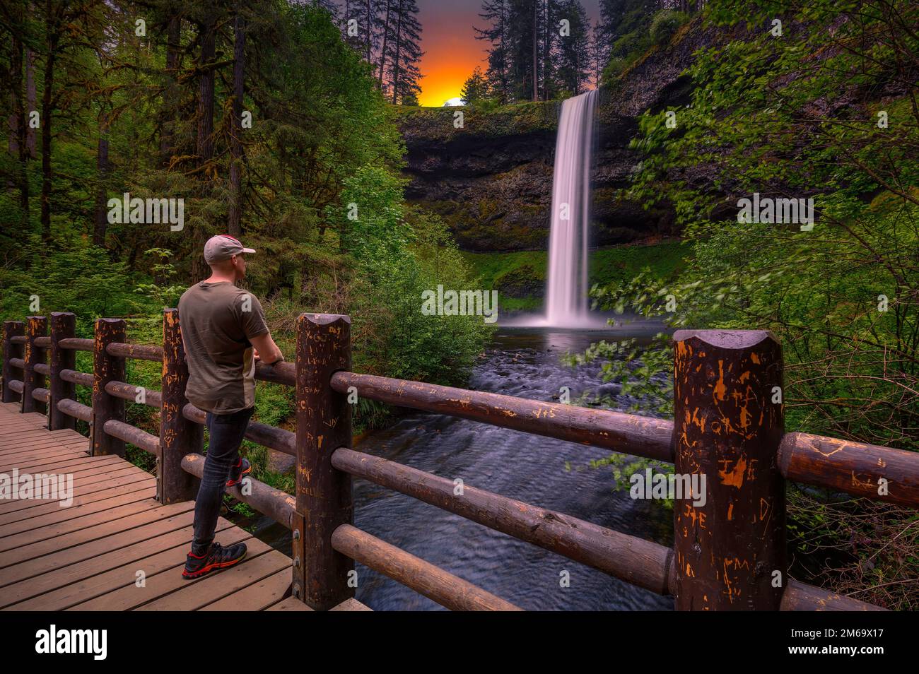 Tourist looking at the South Falls in Silver Falls State Park, Oregon Stock Photo
