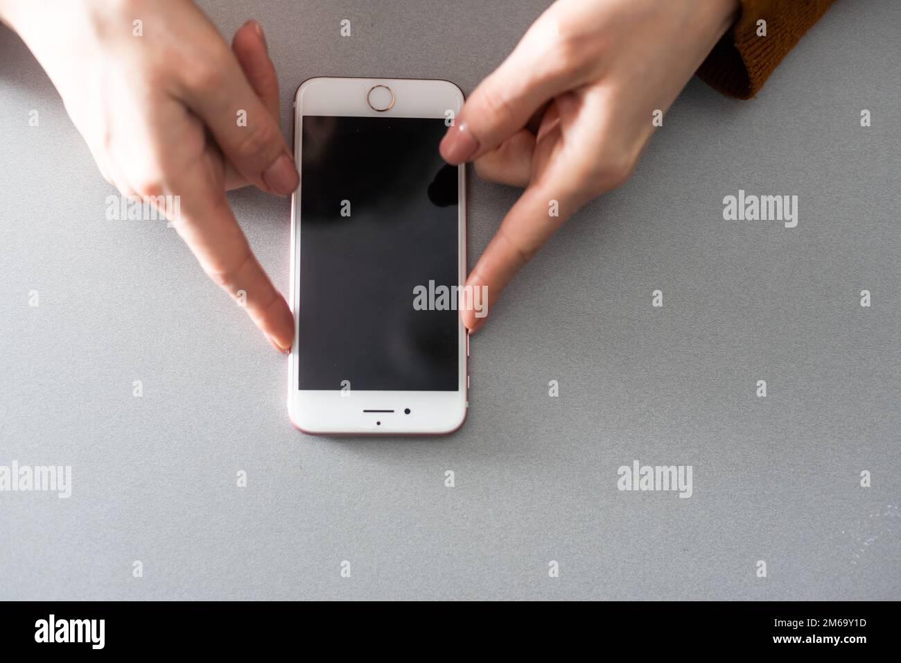 hands holding pressing smartphone buttons Stock Photo