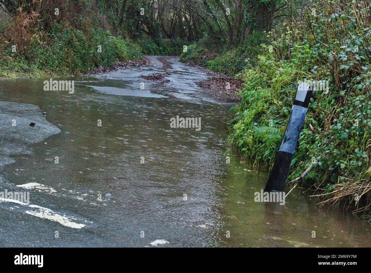 03 Jan 2023, High winds and heavy rain cause flooding and potholes on rural roads in Devon. Credit: Will Tudor/Alamy Live News Stock Photo