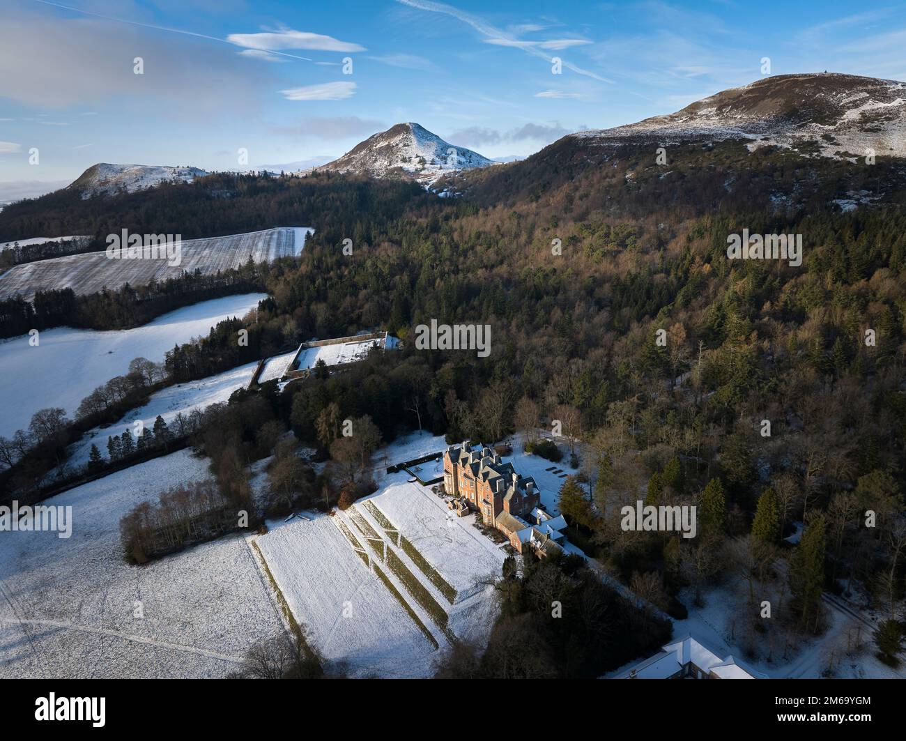 Aerial view of Eildon Hall residence of the Earl of Dalkeith nestling on the south side of The Eildon Hills on a crisp December day. Stock Photo