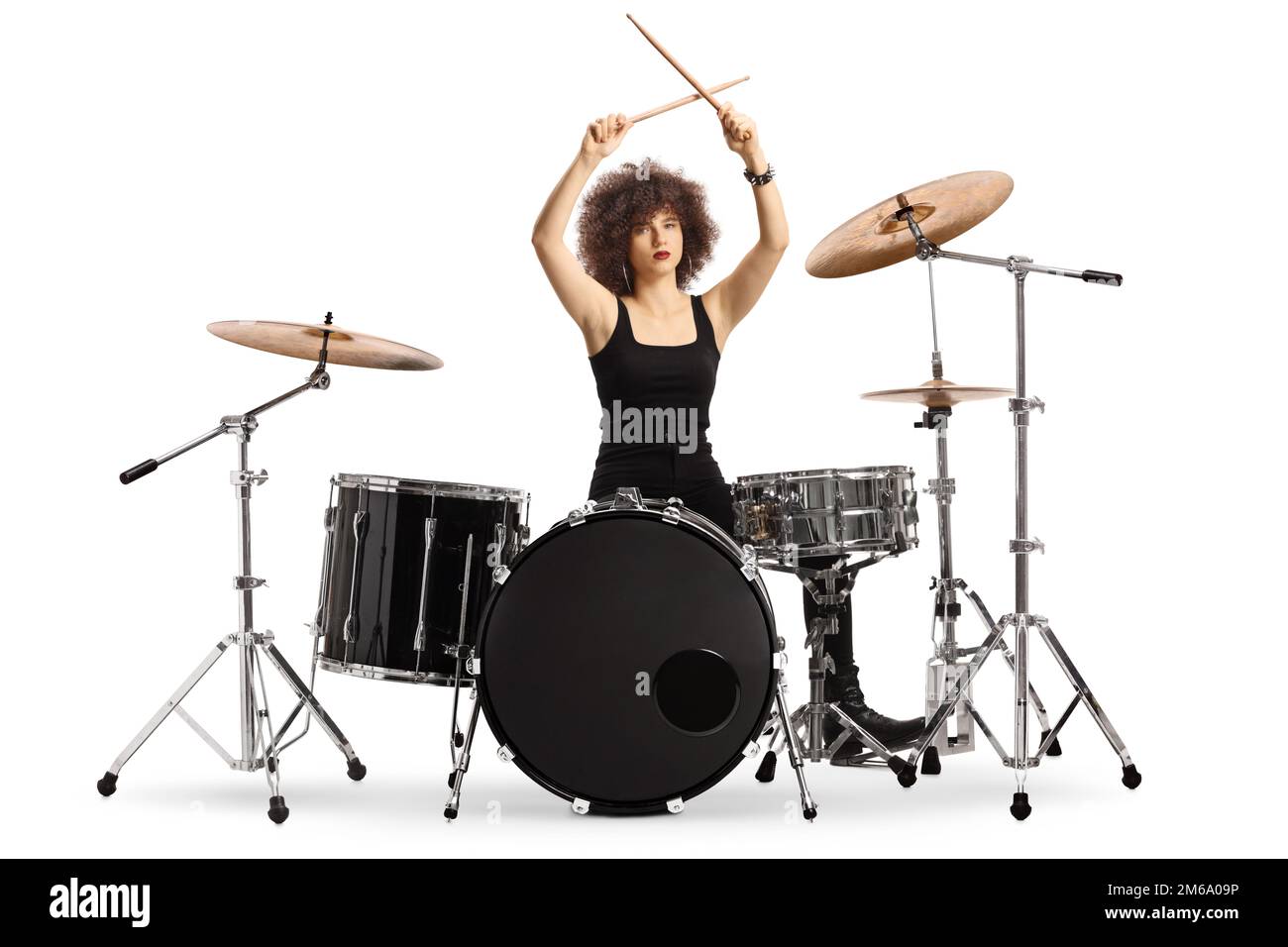 Female drummer lifitng drumsticks isolated on white background Stock Photo