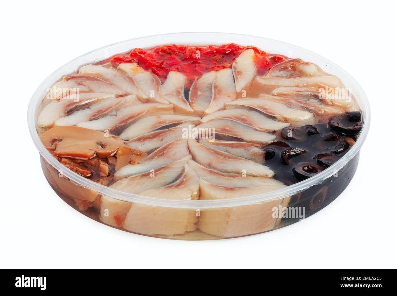 Slices of marinated herring with mushrooms and black olives Stock Photo