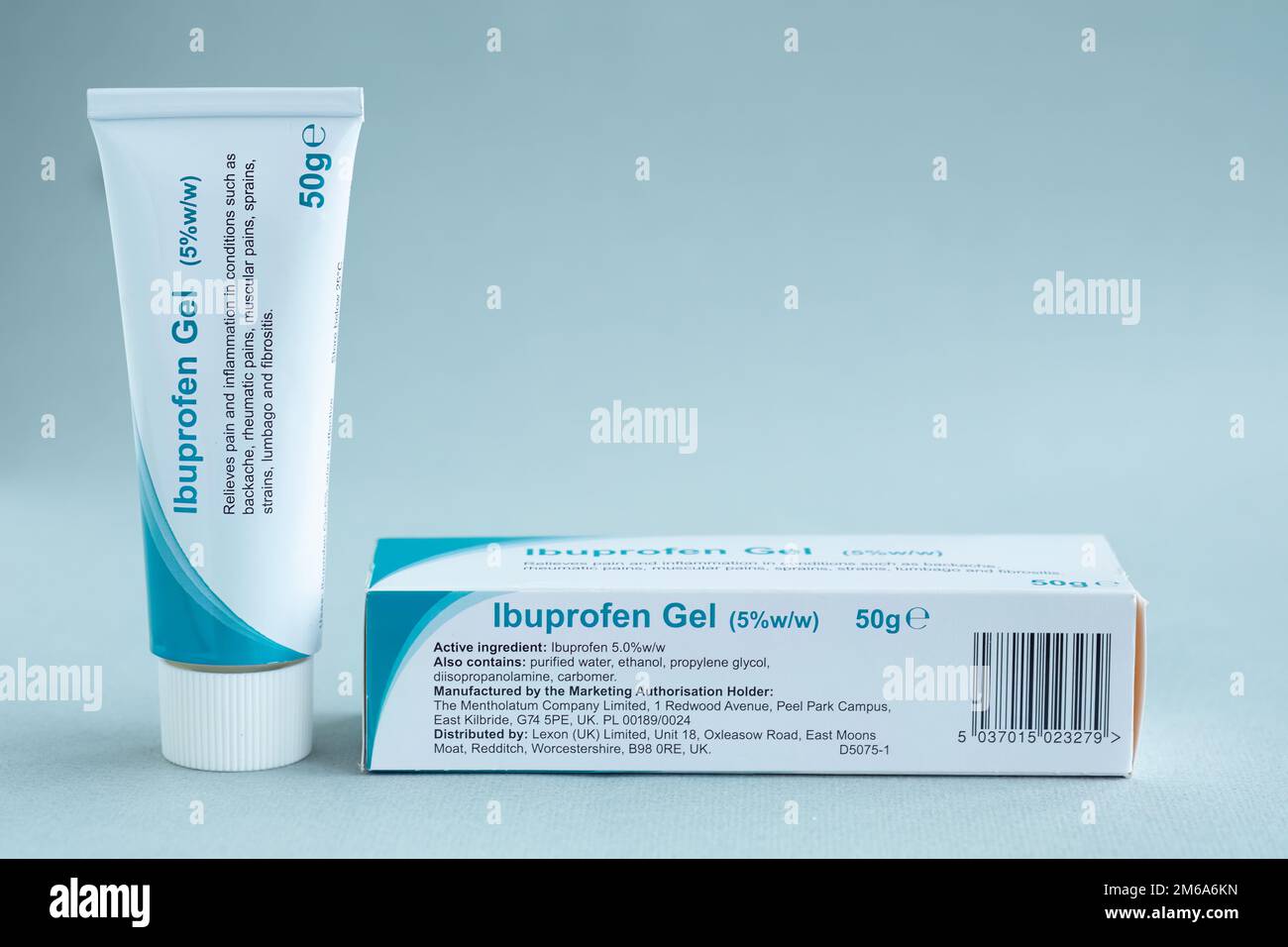 A 50g tube of 5% Ibuprofen gel and its box photographed against a plain background. An over the counter pain relief medication available in pharmacy's Stock Photo